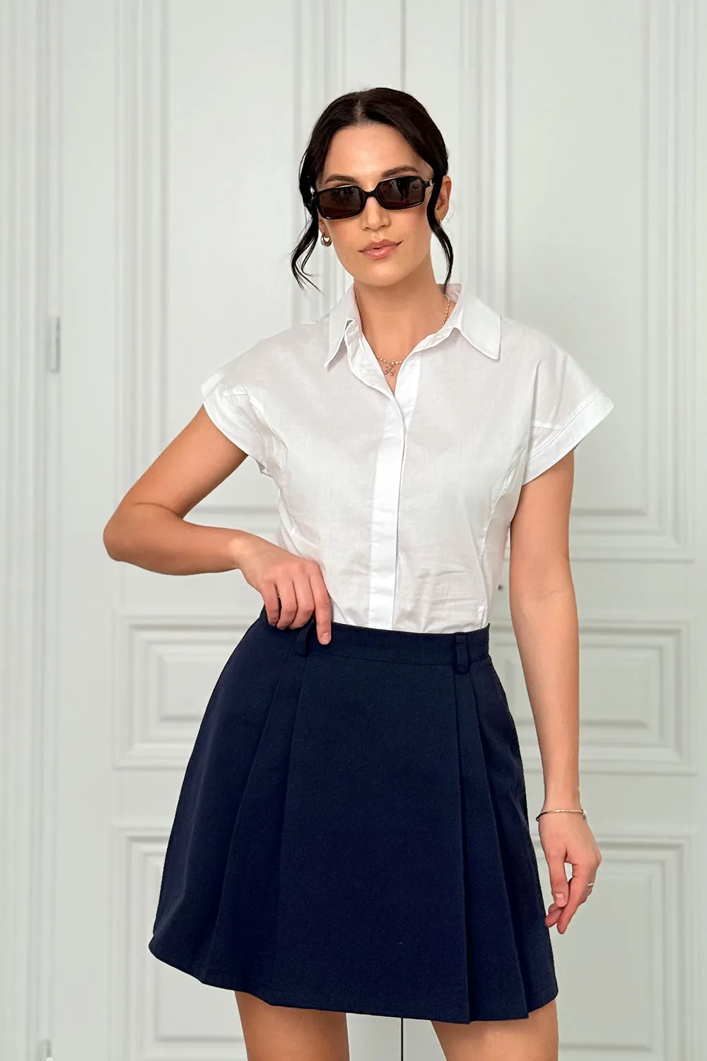 Blue A-line skirt with elegant pleats at the front