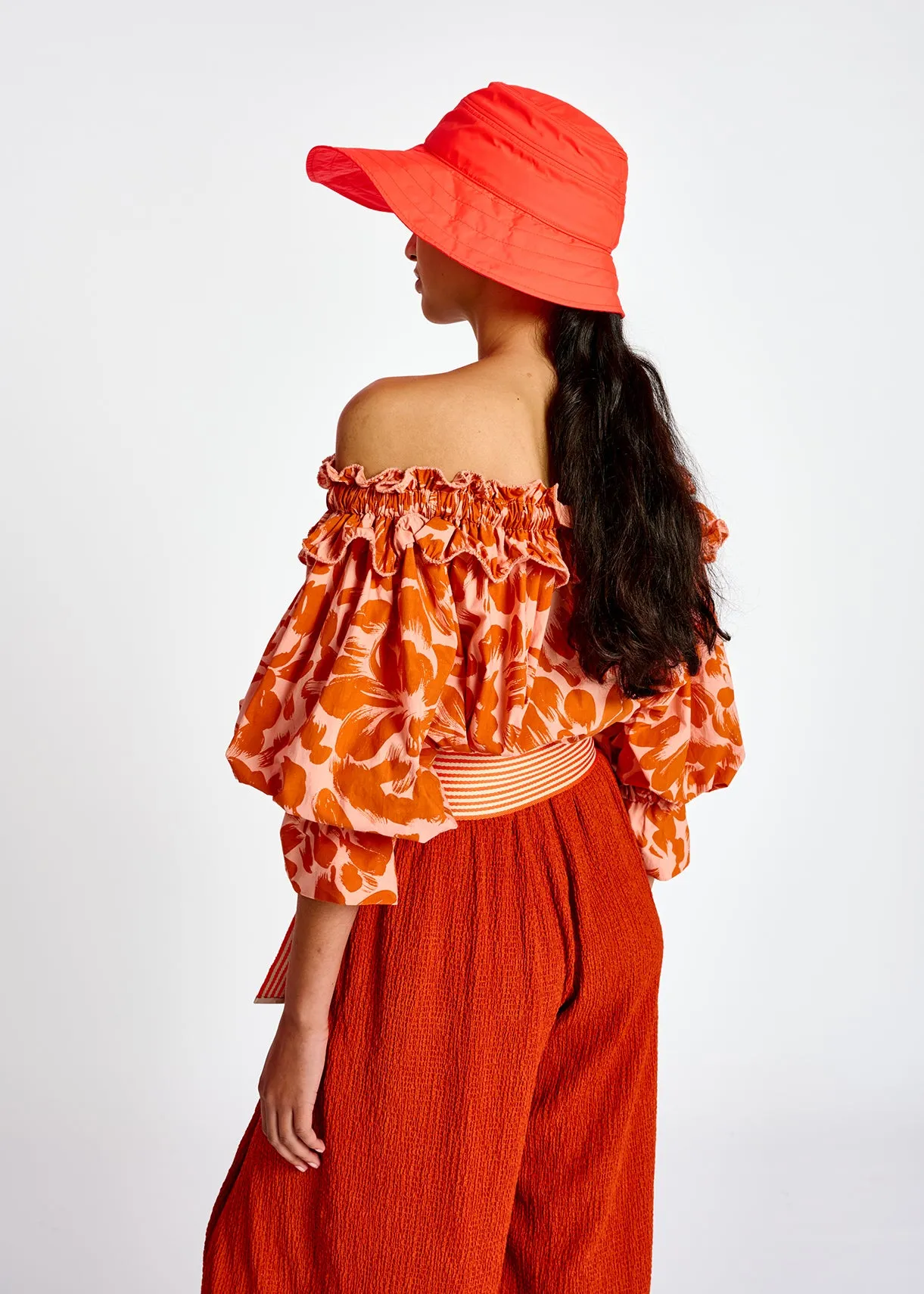 Light pink and orange tropical print off-the-shoulder top
